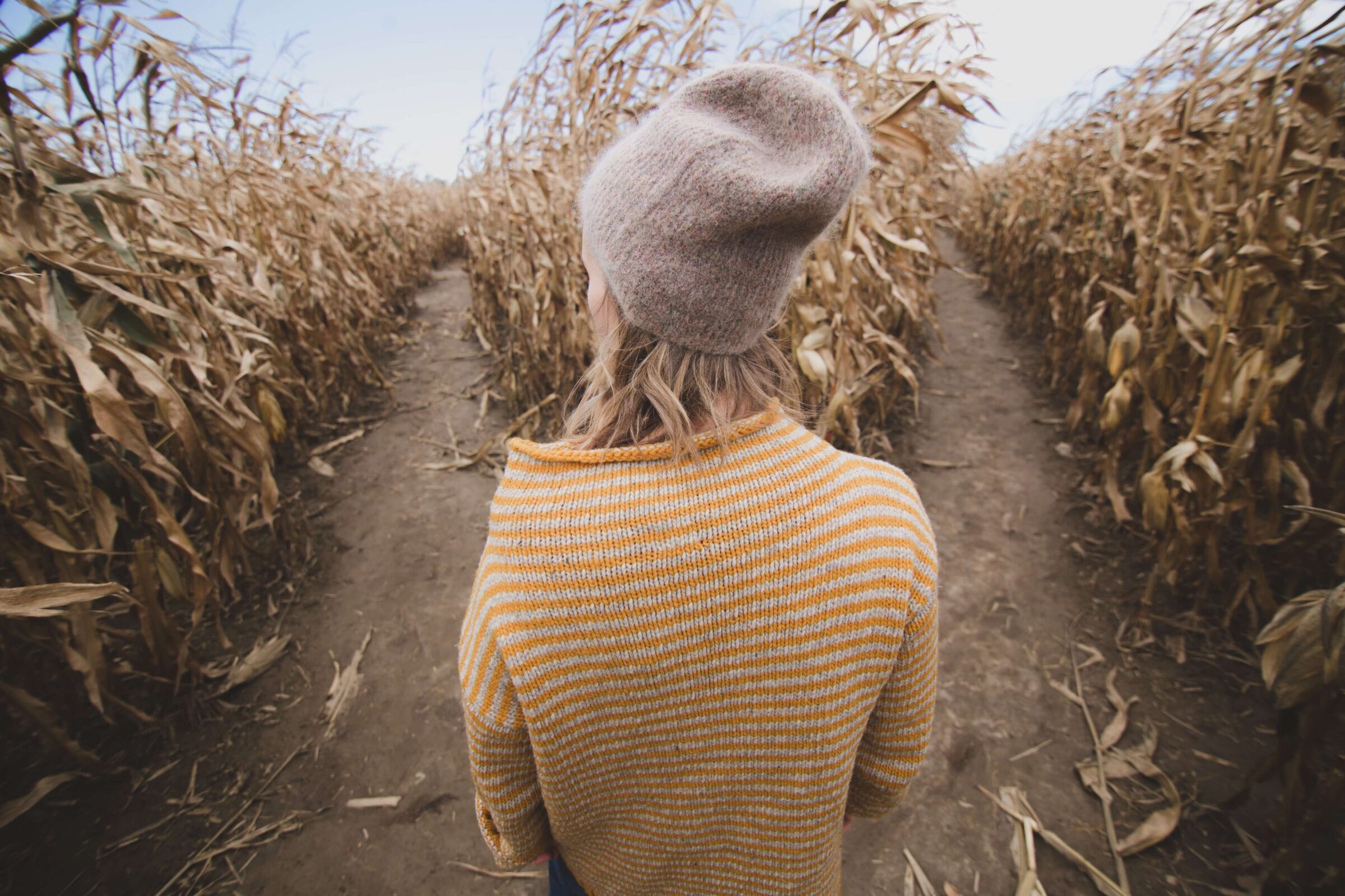 Girl standing at the start of a Corn Maze